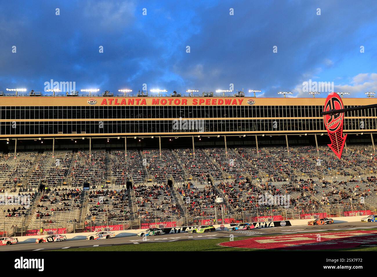 HAMPTON, GA - FEBRUARY 22: The cars race in front of the frontstretch ...
