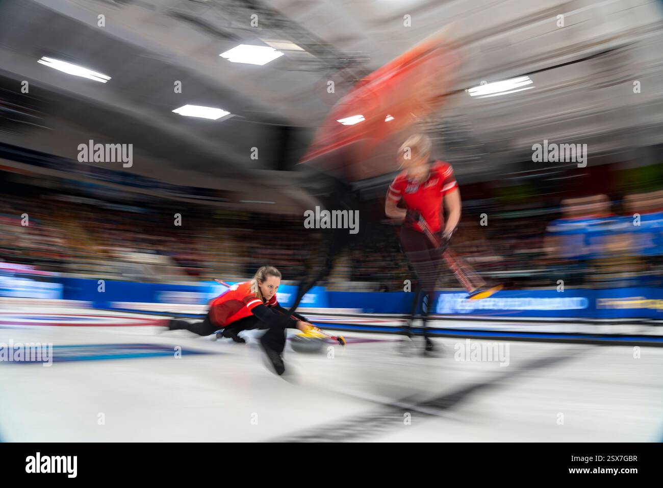 Team Canada skip Rachel Homan delivers a rock against Manitoba in her team