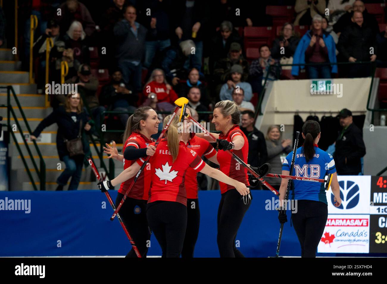 Team Canada celebrates after defeating Manitoba in the quarter finals during Scotties Tournament