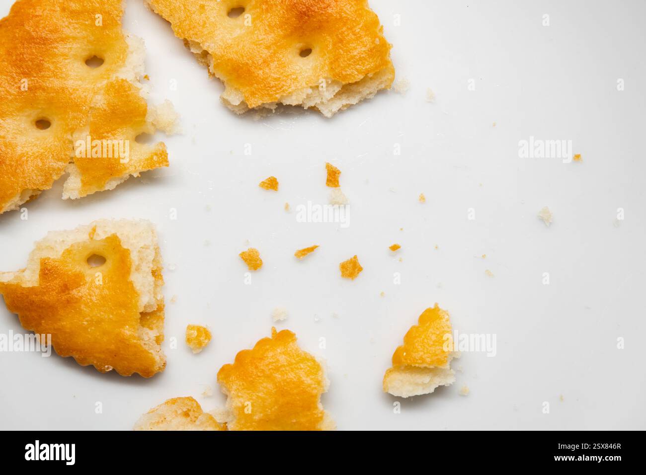 Cracked crackers on white background Stock Photo