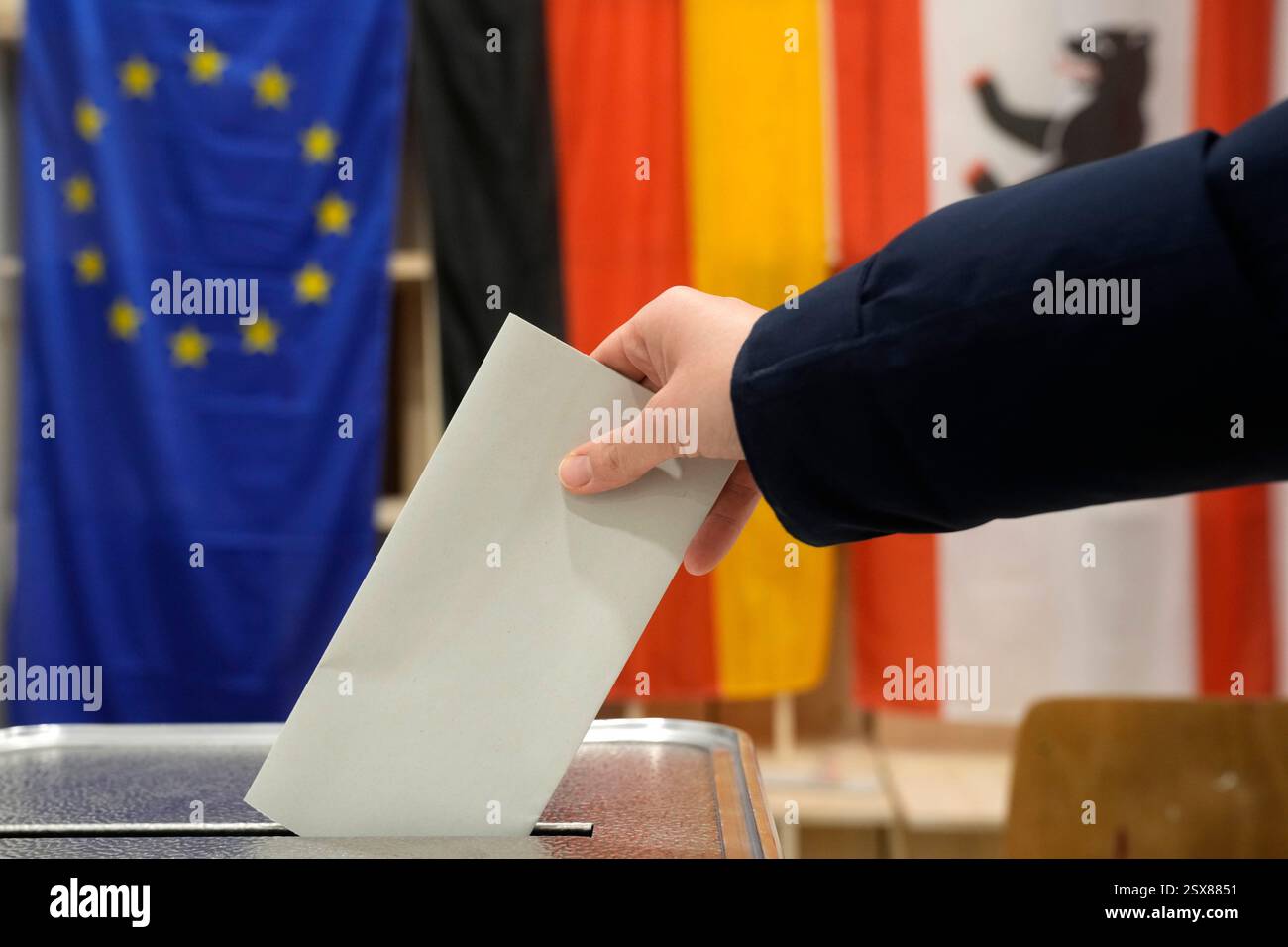 German Polling A resident casts a vote at a polling station in Berlin, Germany, Sunday ...