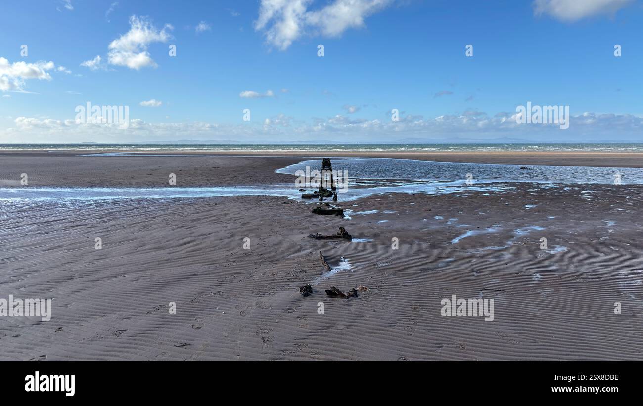 Aberlady Beach near Edinburgh in Scotland. Windswept beach on a bright Spring day. Light clouds, golden sand, sweeping coastline and sea shore - Smartphone Captured Stock Image