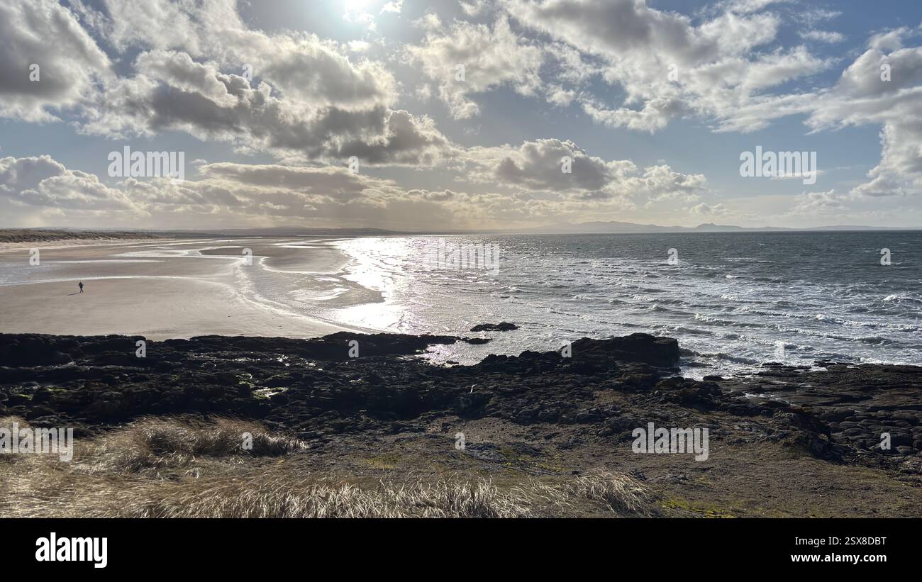 Aberlady Beach near Edinburgh in Scotland. Windswept beach on a bright Spring day. Light clouds, golden sand, sweeping coastline and sea shore - Smartphone Captured Stock Image