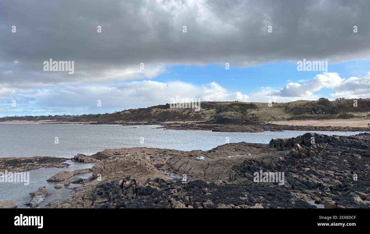 Aberlady Beach near Edinburgh in Scotland. Windswept beach on a bright Spring day. Light clouds, golden sand, sweeping coastline and sea shore - Smartphone Captured Stock Image