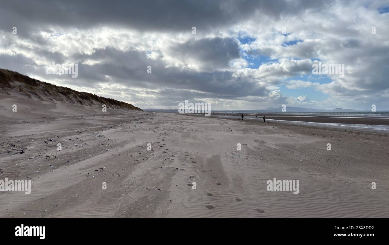 Aberlady Beach near Edinburgh in Scotland. Windswept beach on a bright Spring day. Light clouds, golden sand, sweeping coastline and sea shore - Smartphone Captured Stock Image