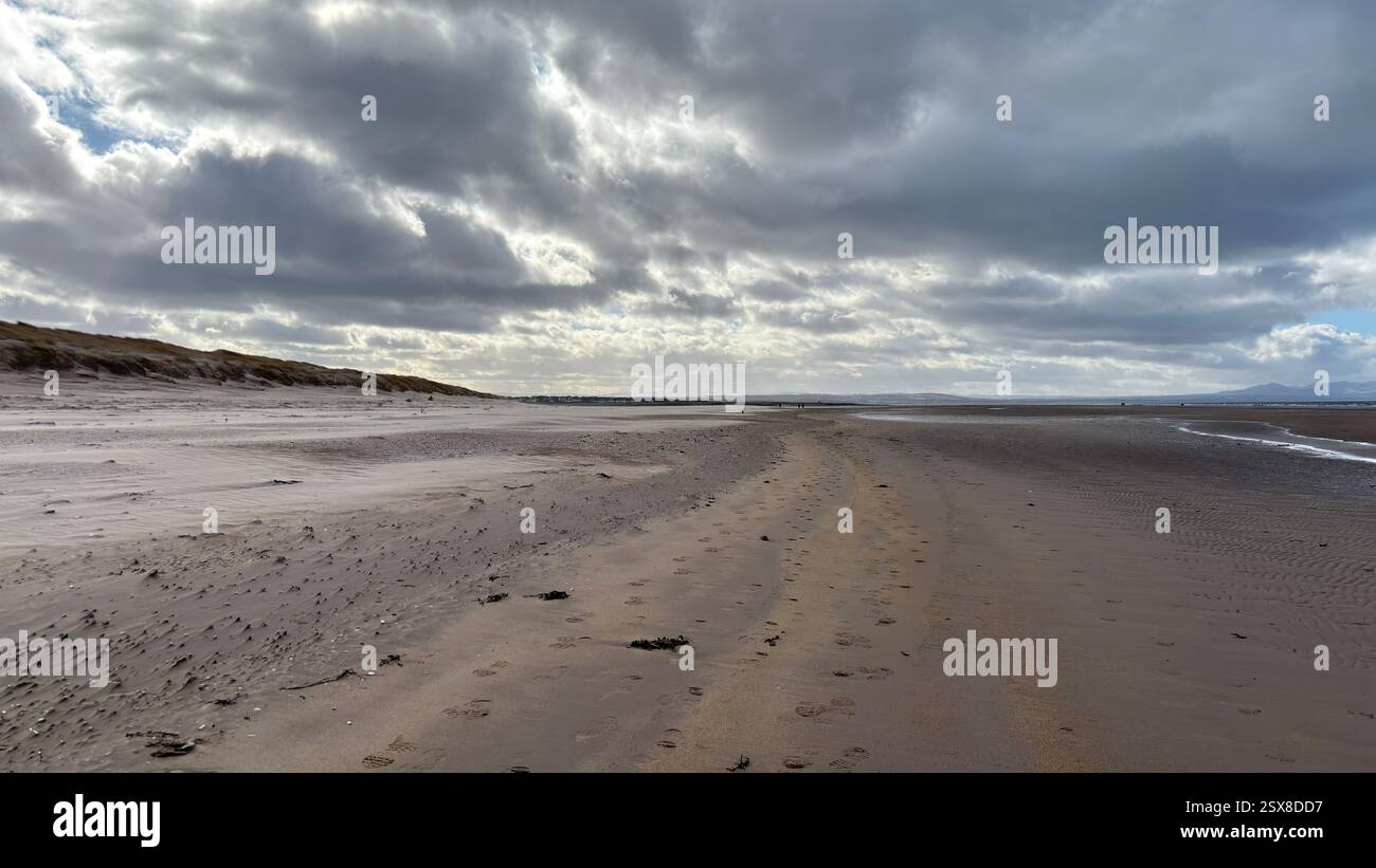 Aberlady Beach near Edinburgh in Scotland. Windswept beach on a bright Spring day. Light clouds, golden sand, sweeping coastline and sea shore - Smartphone Captured Stock Image