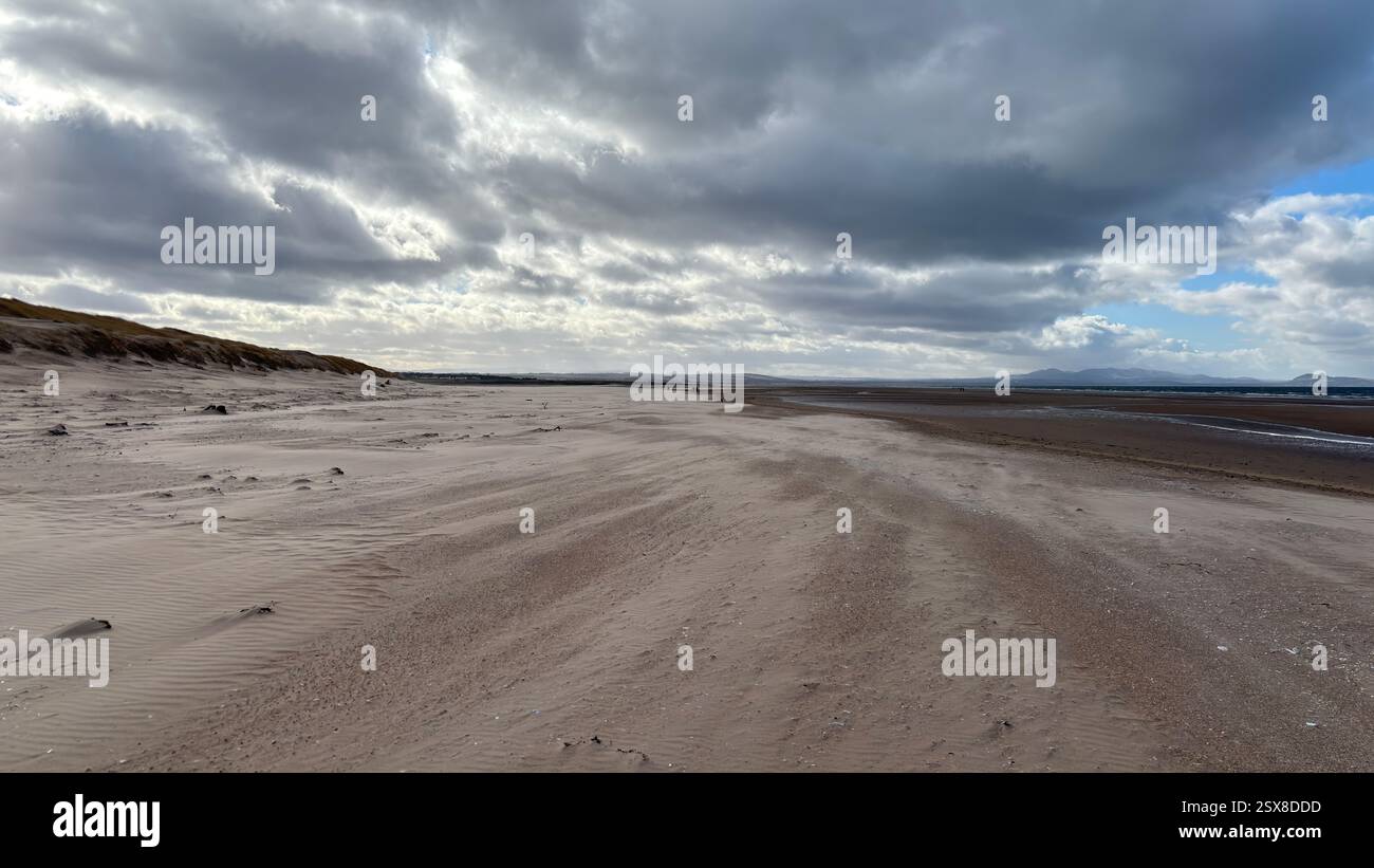 Aberlady Beach near Edinburgh in Scotland. Windswept beach on a bright Spring day. Light clouds, golden sand, sweeping coastline and sea shore - Smartphone Captured Stock Image