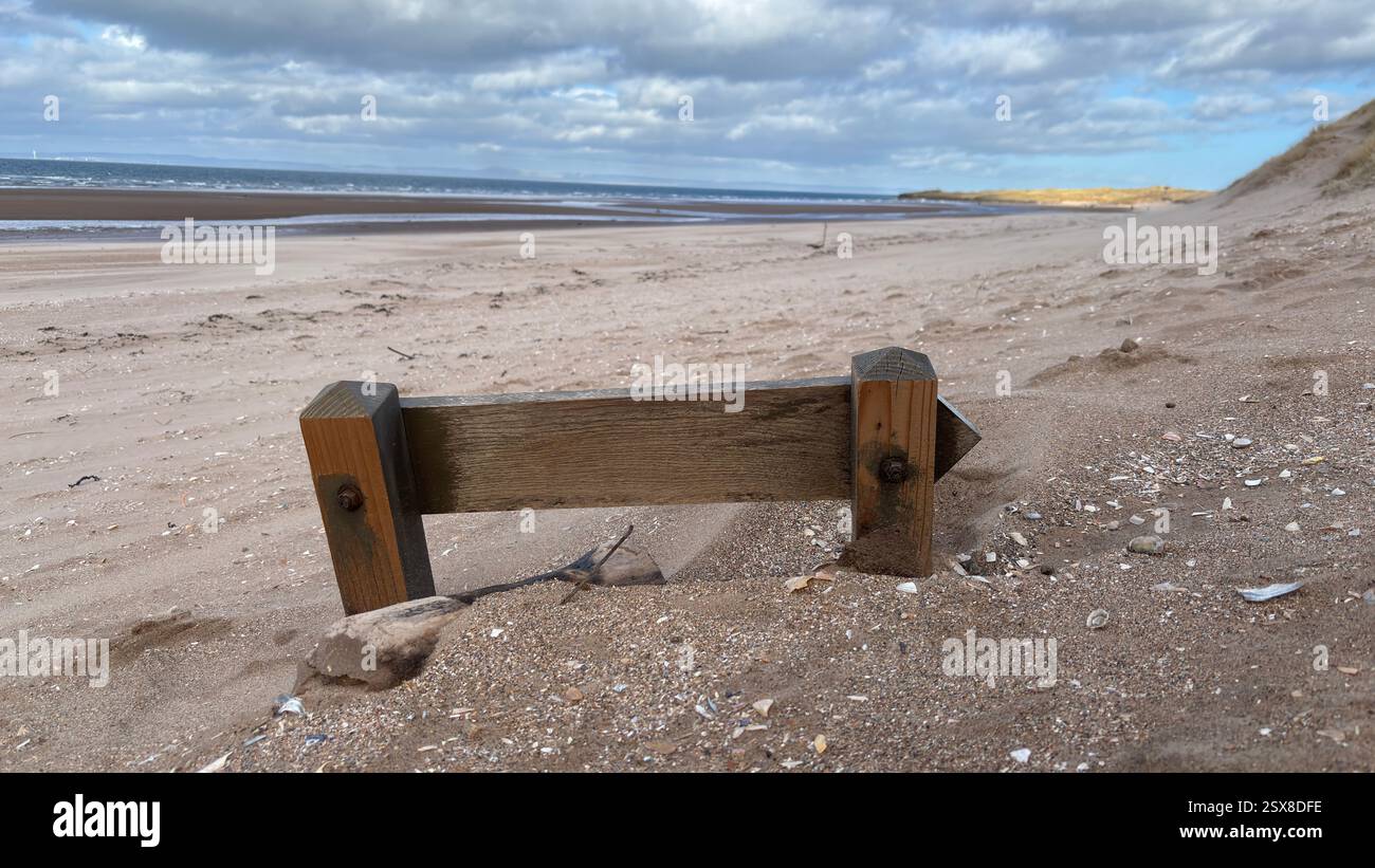 Aberlady Beach near Edinburgh in Scotland. Windswept beach on a bright Spring day. Light clouds, golden sand, sweeping coastline and sea shore - Smartphone Captured Stock Image