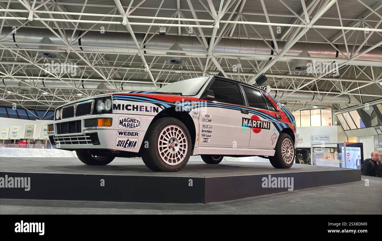 Classic Lancia Delta rally car on display in Turin Airport - Smartphone Captured Stock Image