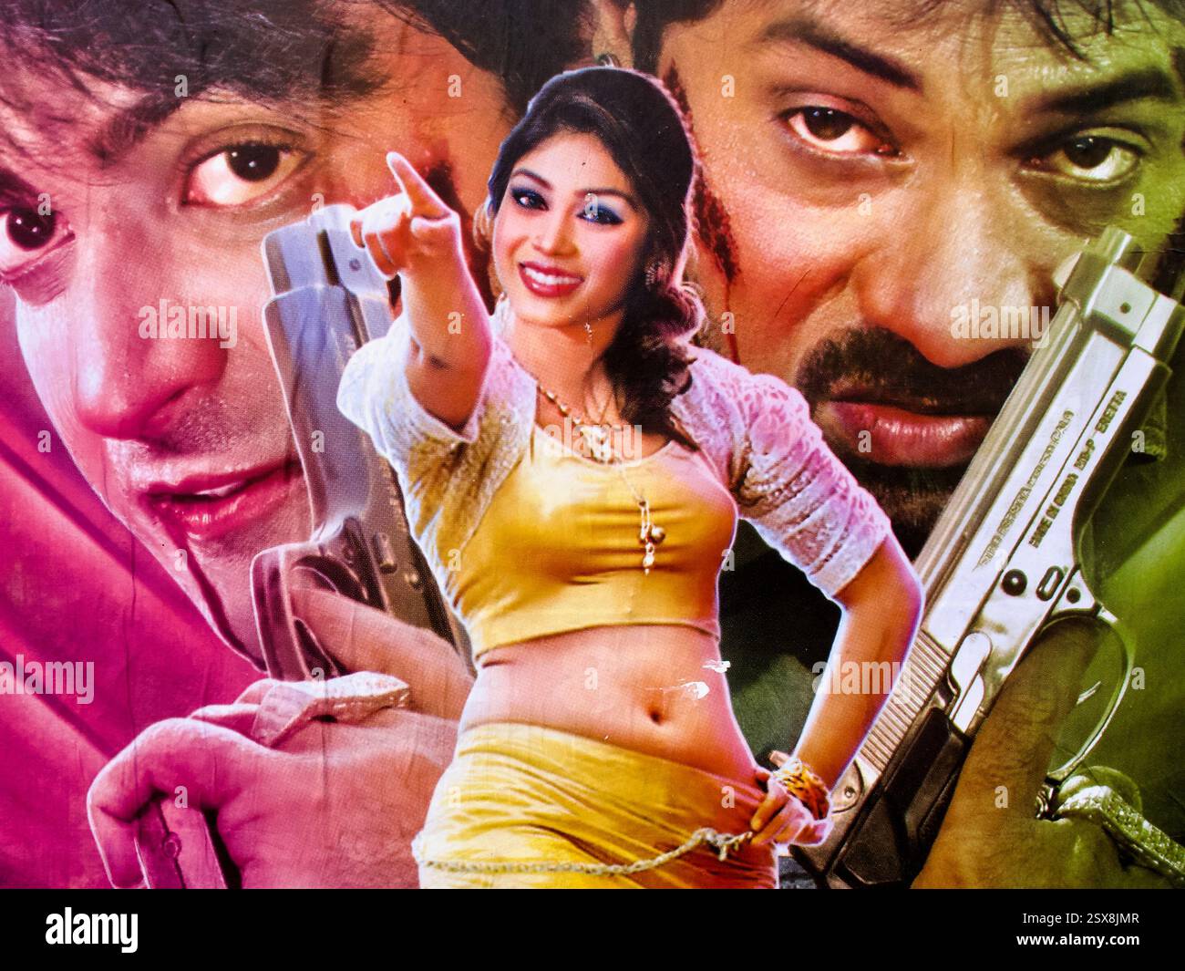 Detail from a Dhallywood action film poster featuring a confident female character in the foreground, with two armed male figures in the background. Stock Photo
