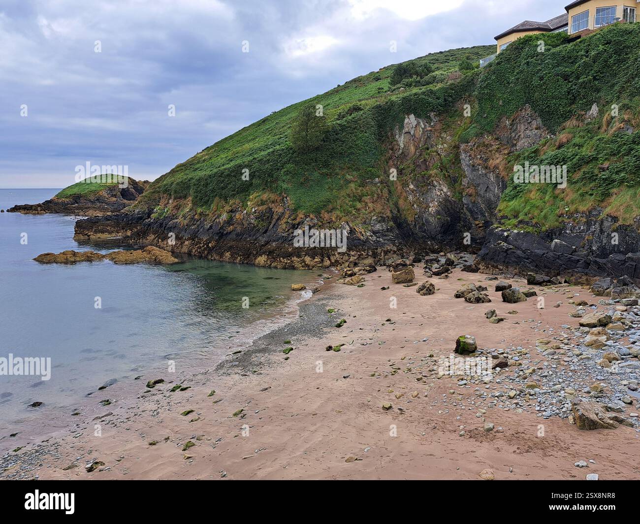 Helvick or Helvick Head  is a headland on the southern end of Dungarvan Harbour, Ireland; it is the eastern tip of the Ring Peninsula. - Smartphone Captured Stock Image