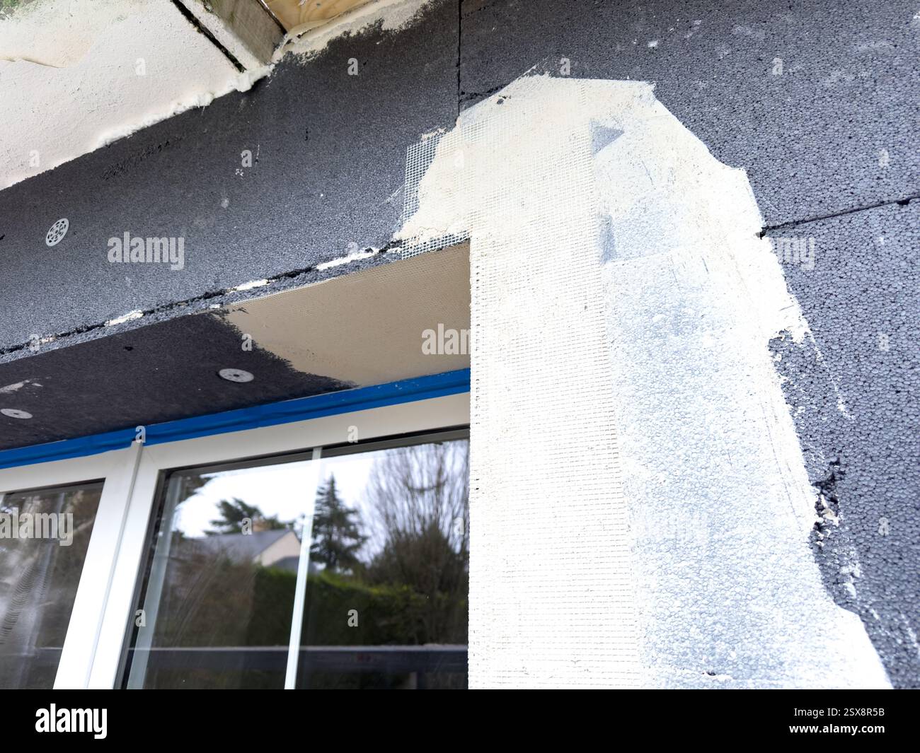 Picture of Exterior wall renovation process reveals layers of texture and ...