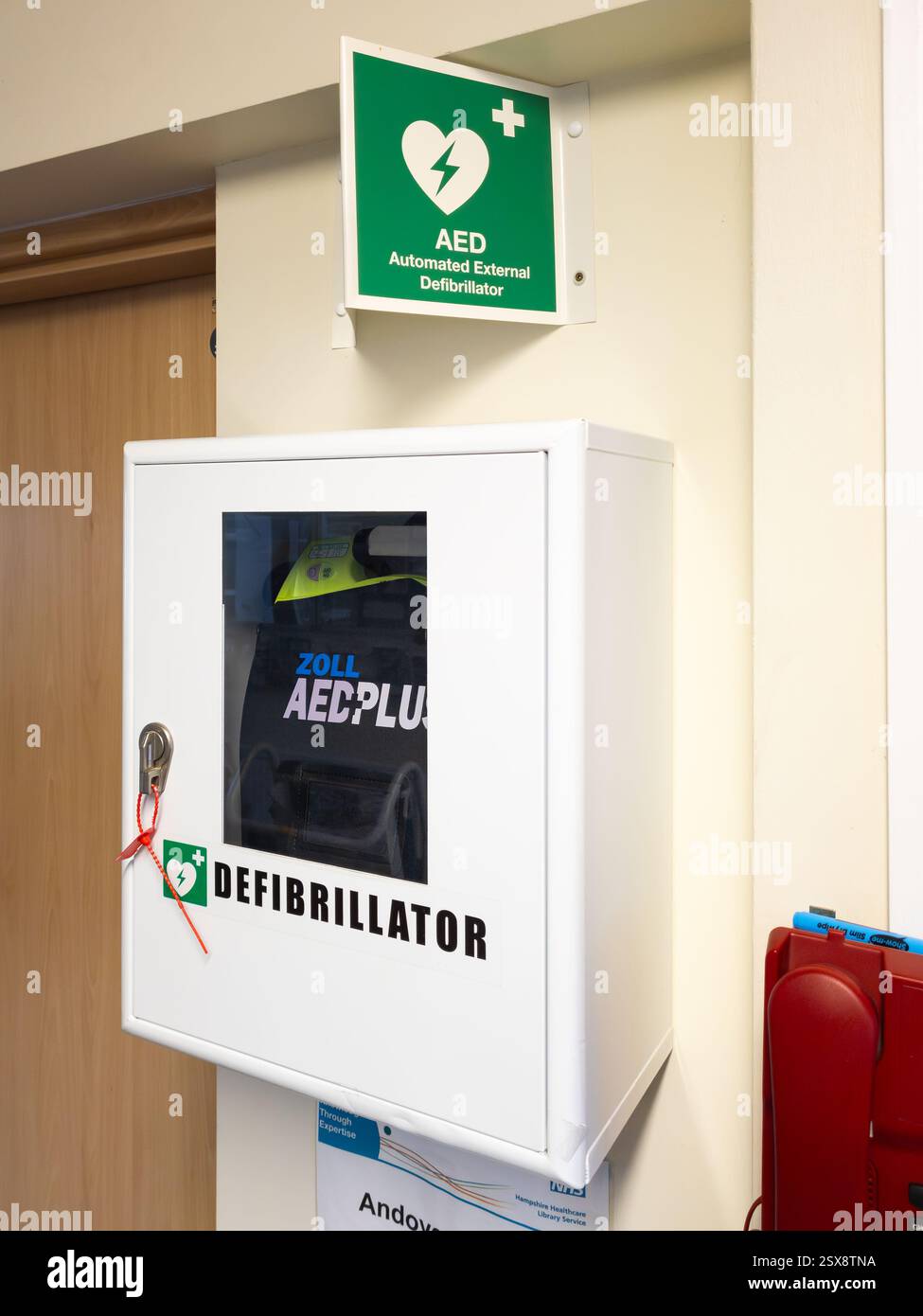 AED (Automated External Defibrillator) at Andover hospital, UK. A defibrillator gives an electric shock to someone's heart who is in cardiac arrest - Smartphone Captured Stock Image