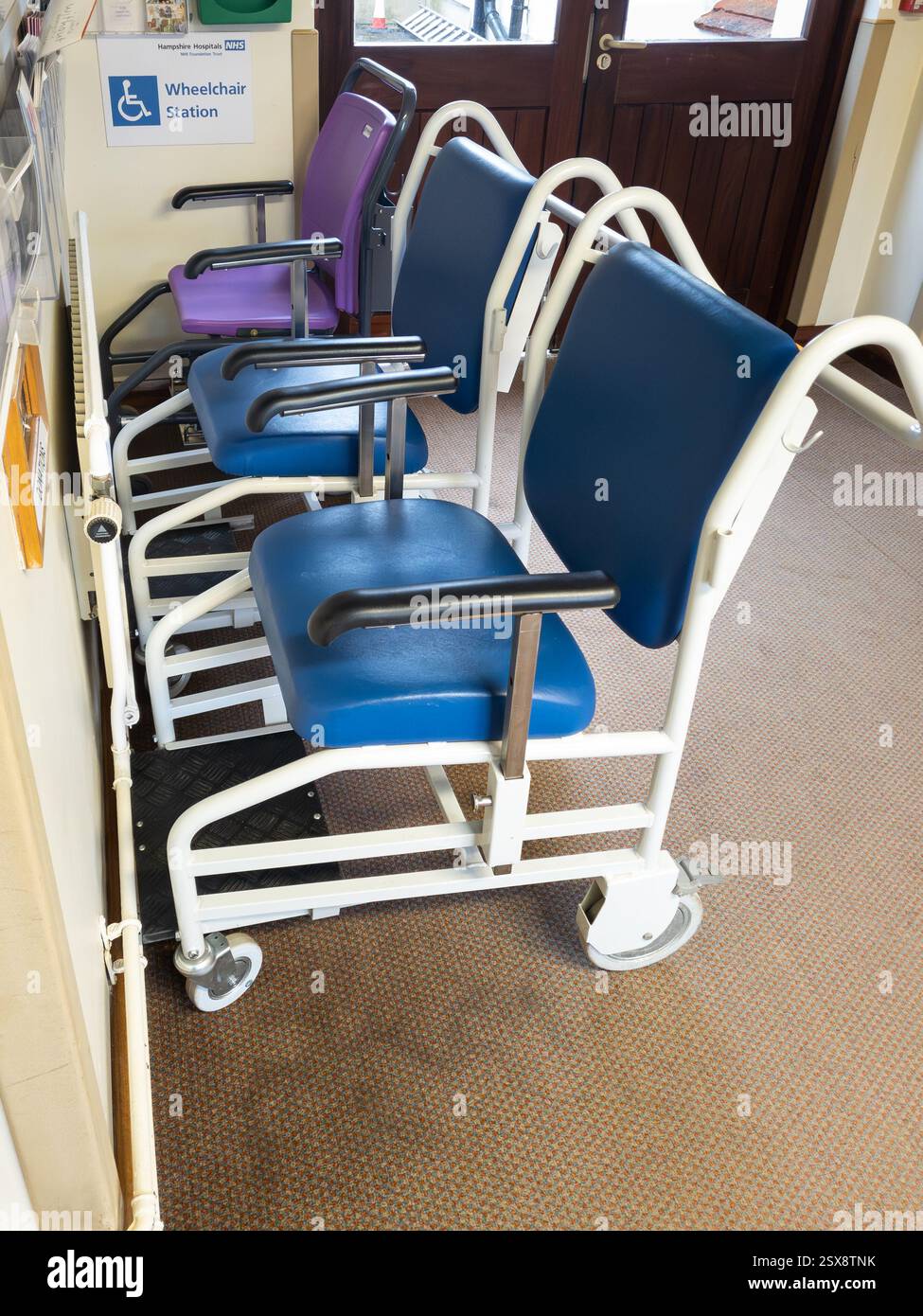 Manual wheelchairs in Andover hospital, England. Concept: physiotherapy, wheelchair service, NHS concept, NHS wheelchairs, National Health Service - Smartphone Captured Stock Image