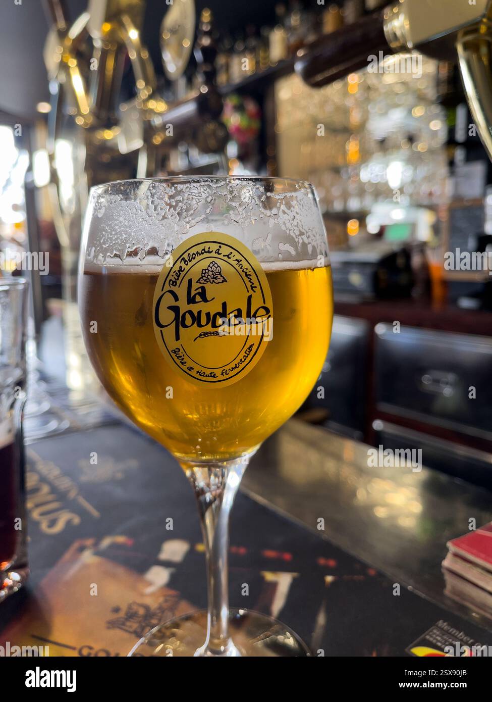 La Goudale beer blonde on the bar of the bikers bar, Aux Indépendants, Dunkirk, France. - Smartphone Captured Stock Image