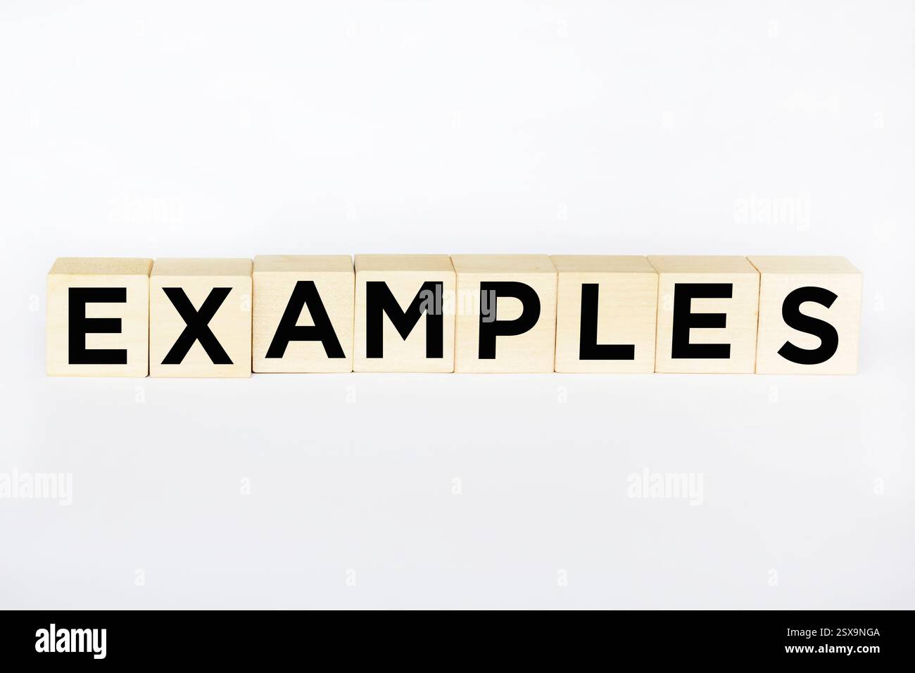 The symbol of the examples. The conceptual word "examples" on wooden ...