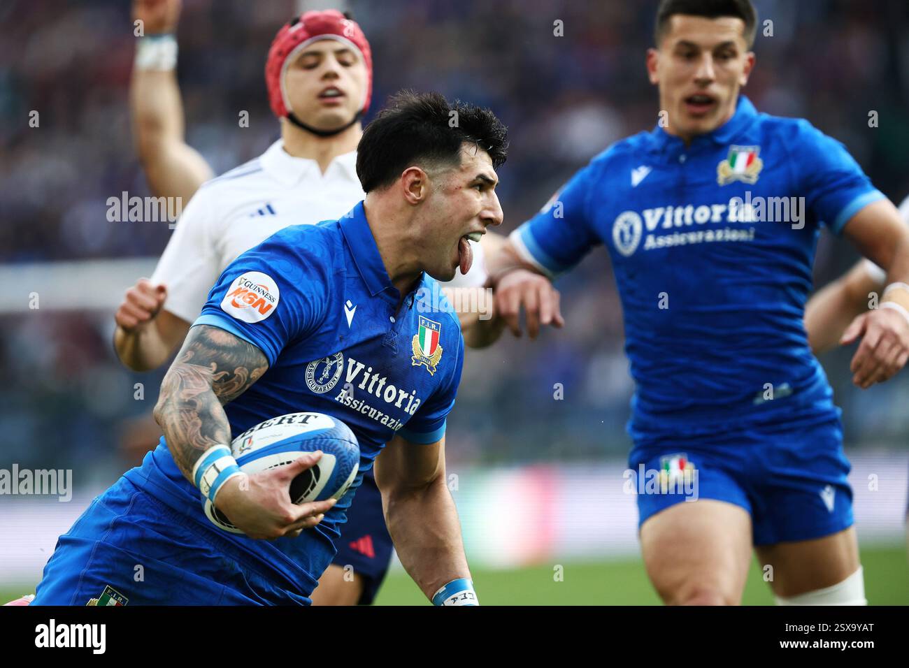 Rome, Italy. 23th Feb, 2025. Tommaso Menoncello of Italy runs in a try ...