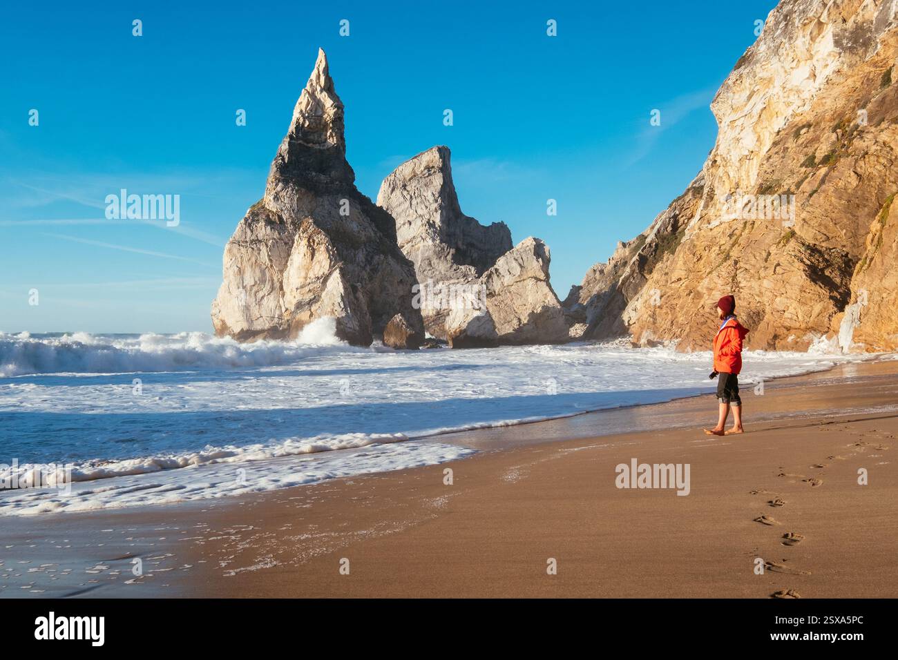 Woman walking on foamy shore hi-res stock photography and images - Alamy