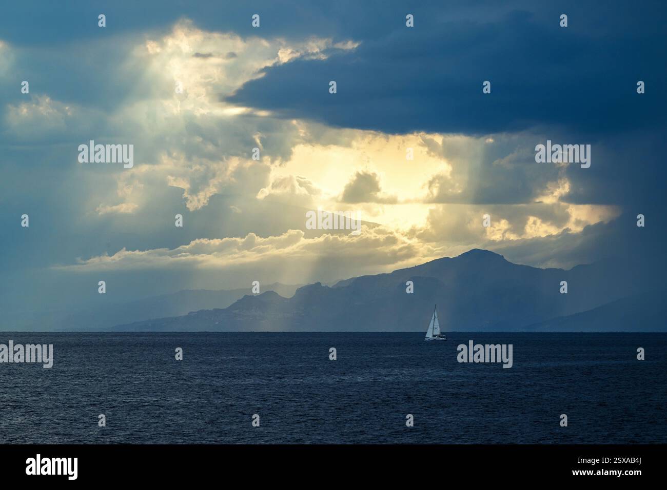 Golden sun ray light through clouds hi-res stock photography and images ...