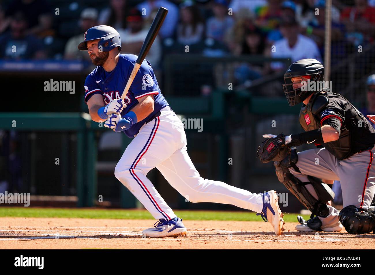 Texas Rangers' Jake Burger follows through as San Francisco Giants ...
