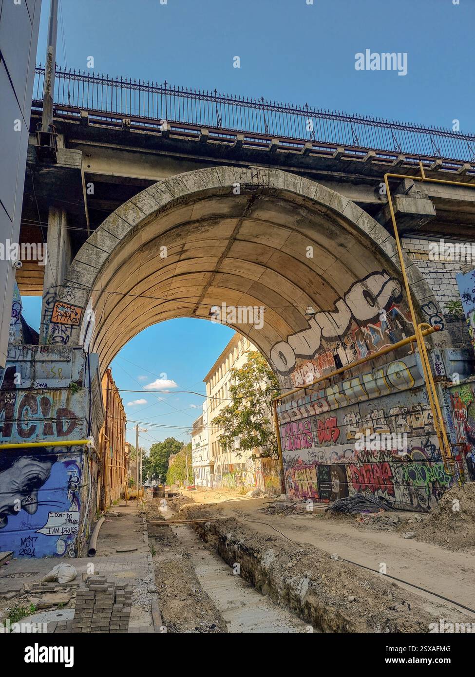 High historical stone bridge with graffiti: Stroganovsky bridge over  Devolanovskyi descent, former Karantinnaya street in Kanava area in Odesa/Odessa - Smartphone Captured Stock Image