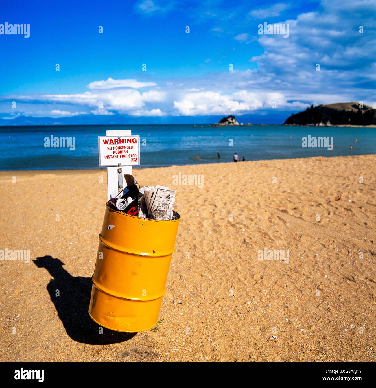 Trash can on beach Stock Photo
