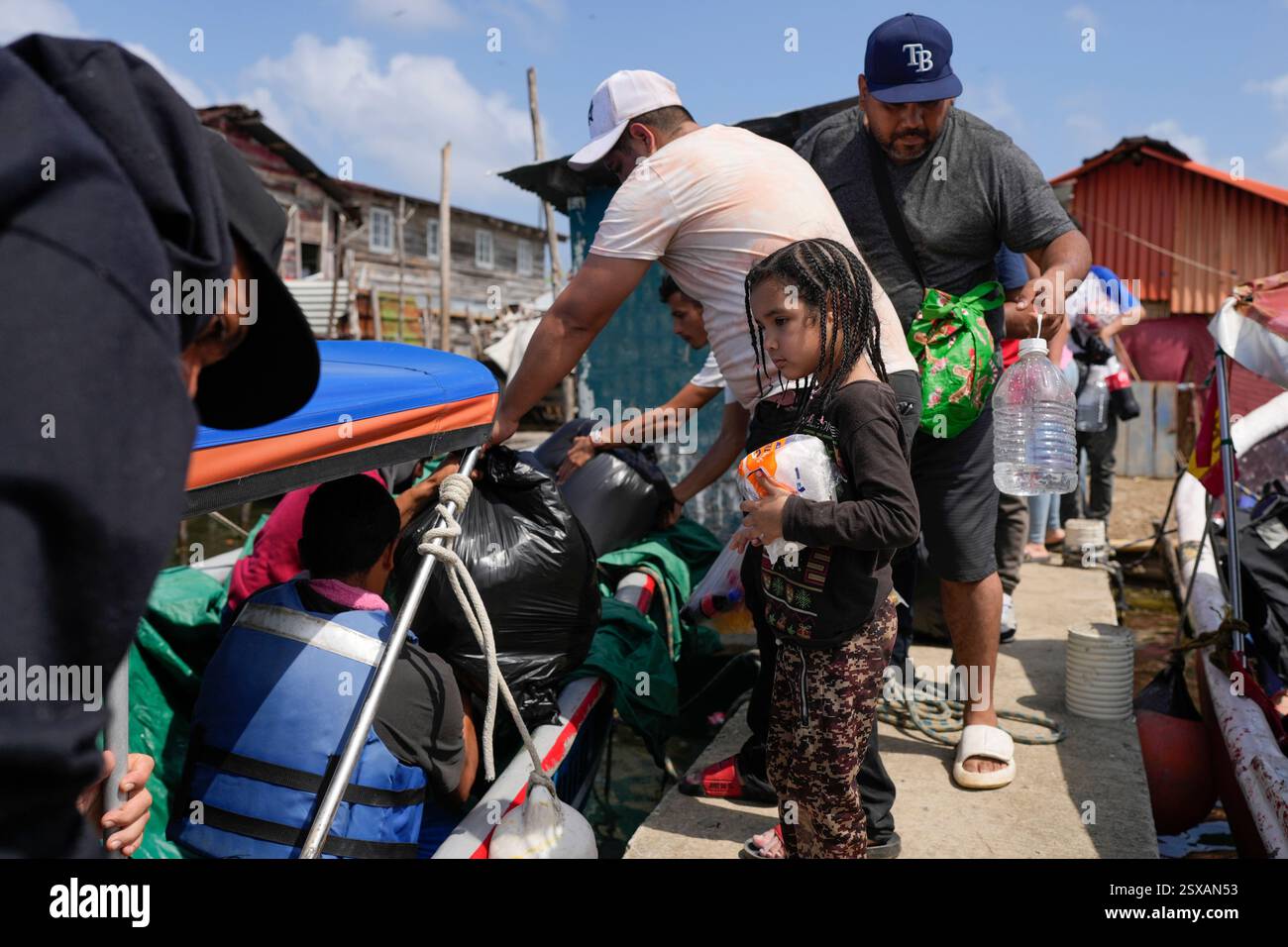Venezuelan migrants board boats to Colombia on Panama's Caribbean