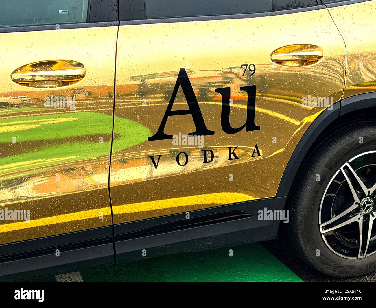 Pontyclun, Wales, Uk - 19 February 2025: Close up view of the branding on the side of a car used by Au Vodka, which is a Welsh distillery. - Smartphone Captured Stock Image Pontyclun, Wales, Uk - 19 February 2025: Close up view of the branding on the side of a car used by Au Vodka, which is a Welsh distillery. - Smartphone Captured Stock Image