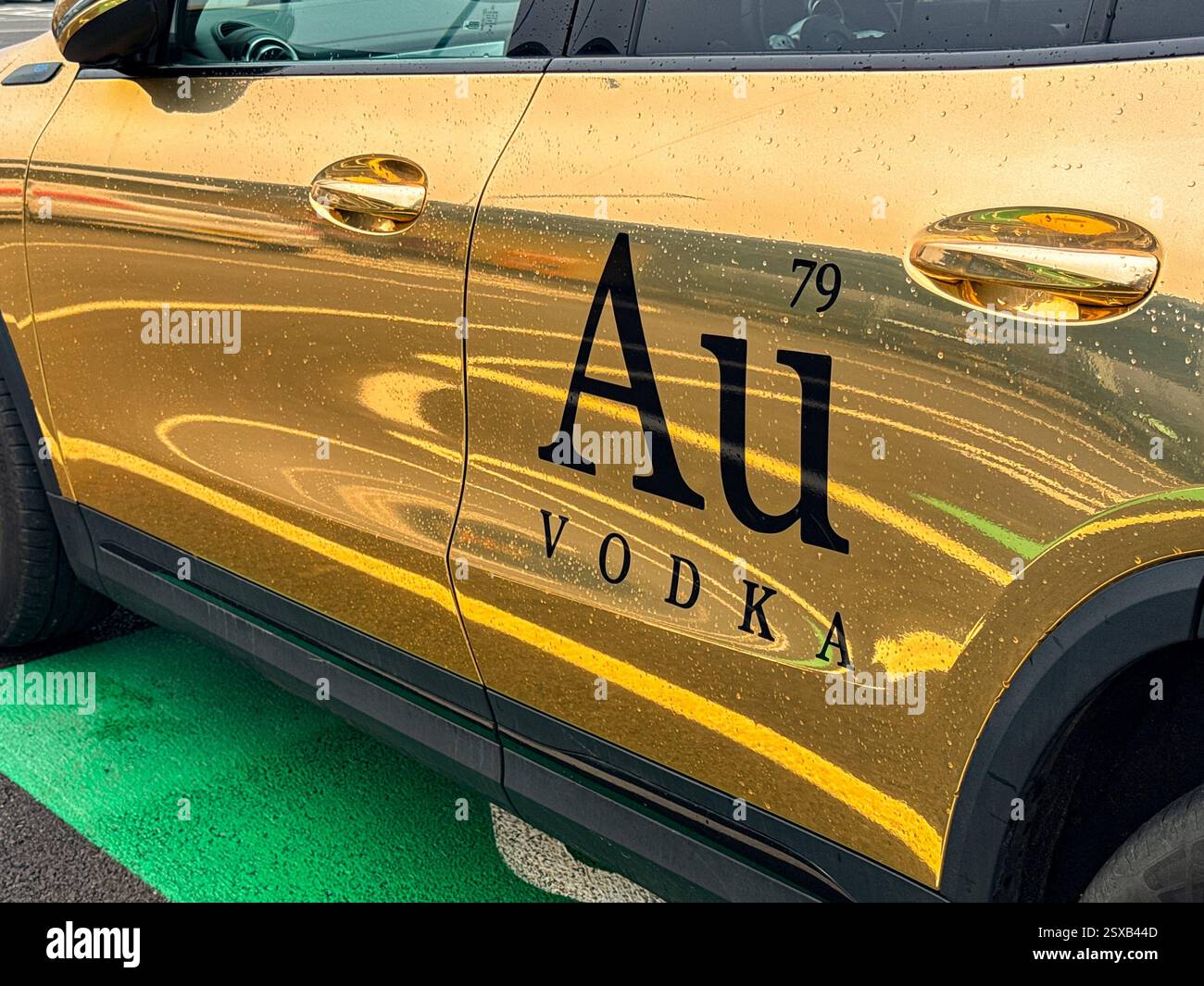 Pontyclun, Wales, Uk - 19 February 2025: Close up view of the branding on the side of a car used by Au Vodka, which is a Welsh distillery. - Smartphone Captured Stock Image Pontyclun, Wales, Uk - 19 February 2025: Close up view of the branding on the side of a car used by Au Vodka, which is a Welsh distillery. - Smartphone Captured Stock Image