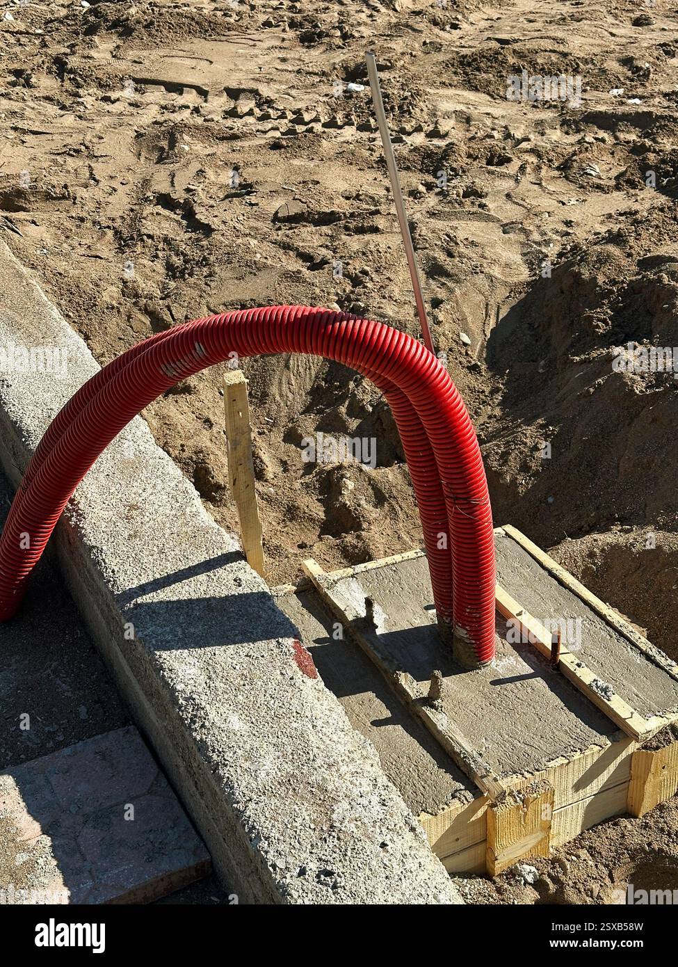 Construction Site with Red Corrugated Electrical Conduit  Stock Photo