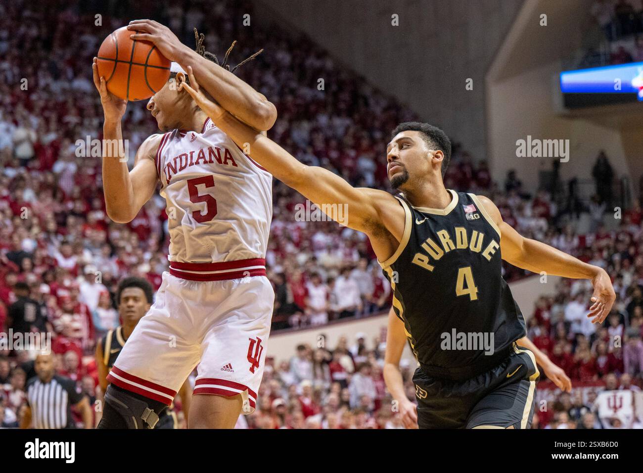 Purdue forward Trey Kaufman-Renn (4) tries to steal the ball from ...