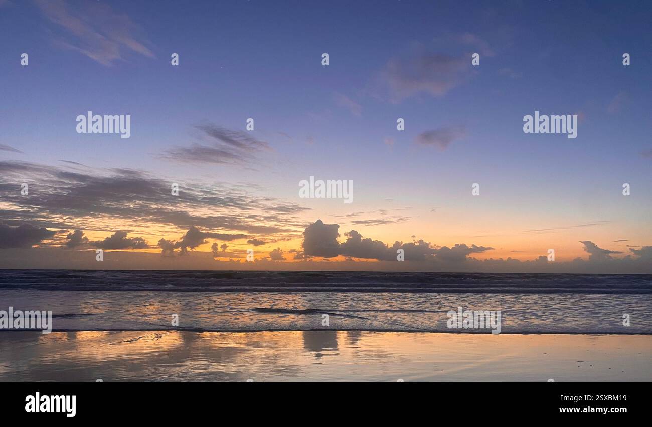 Stunning coastal sunrise over beach and ocean - Smartphone Captured Stock Image