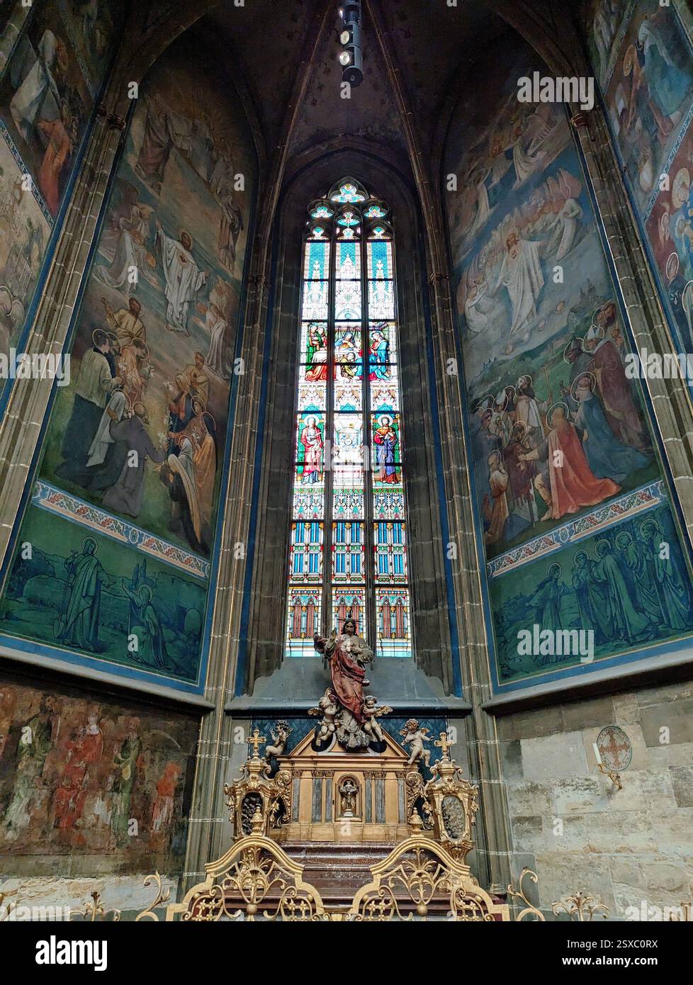 Stunning frescoes and stained glass illuminate history and faith inside St. Vitus Cathedral, Prague Castle. - Smartphone Captured Stock Image
