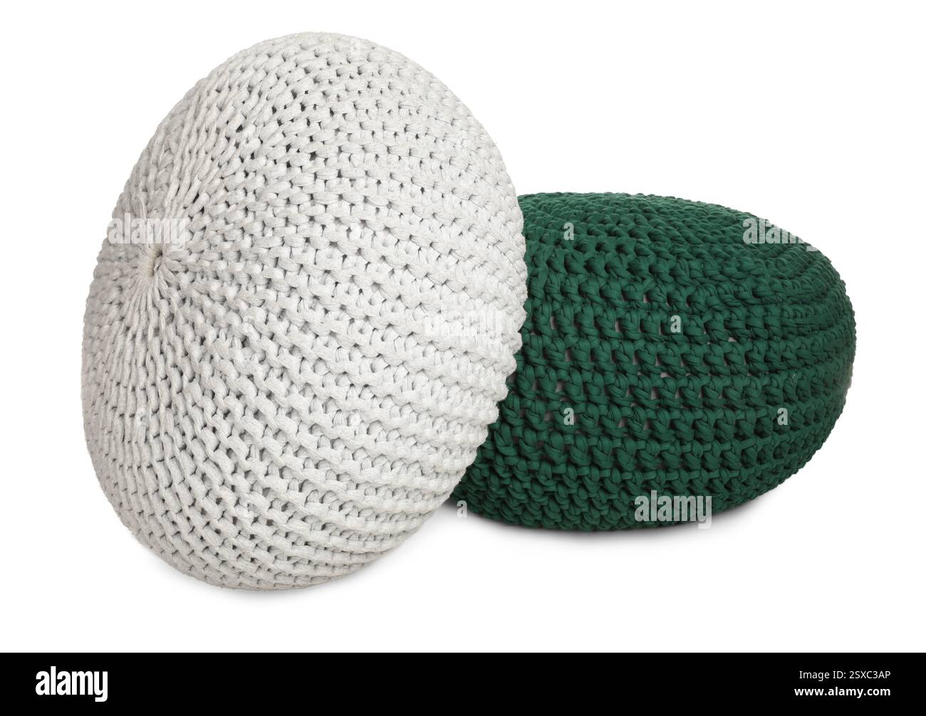 Different stylish knitted poufs on white background Stock Photo