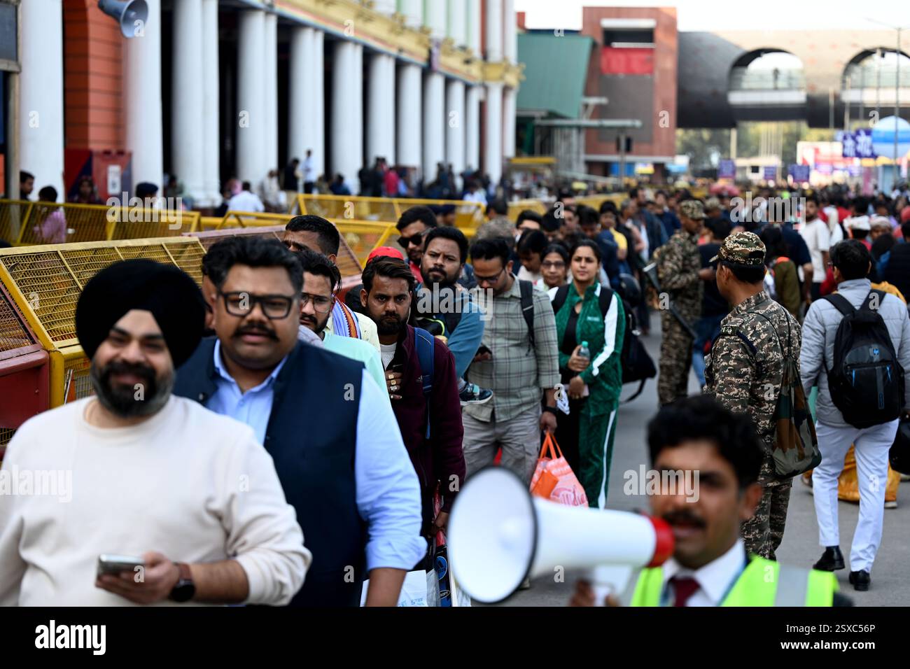 NEW DELHI, INDIA - FEBRUARY 23: Passengers in long queues to board the ...