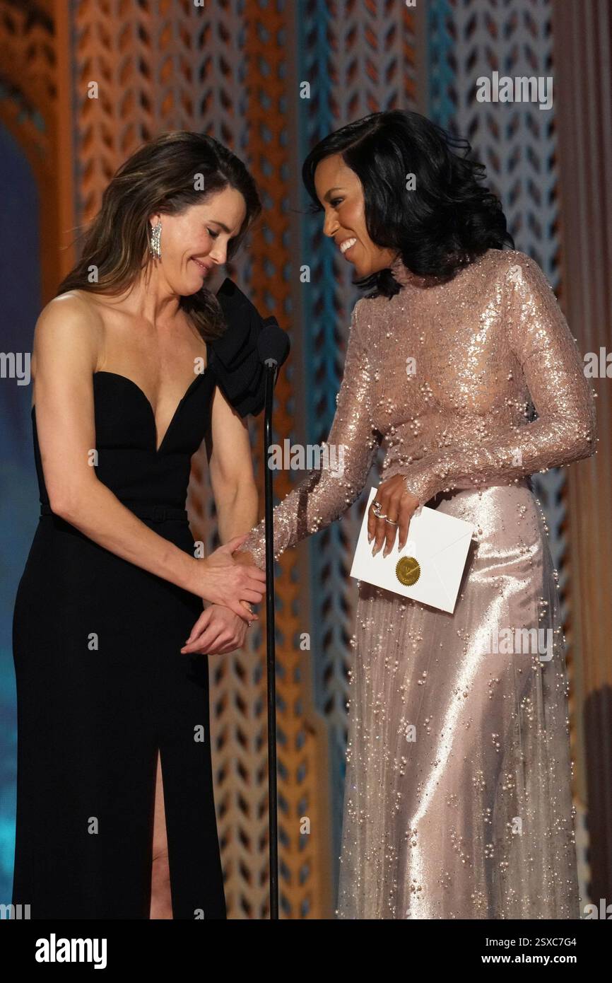 Keri Russell, left, and Kerry Washington present the award for