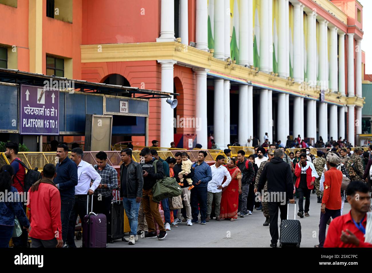 NEW DELHI, INDIA - FEBRUARY 23: Passengers in long queues to board the ...