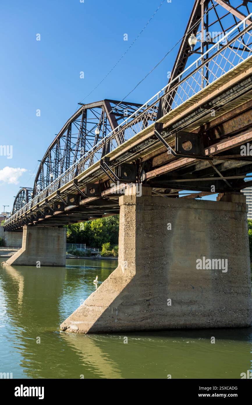 Fly Over Railing Bridge with a railing and a bird flying over the water. The bridge is ...