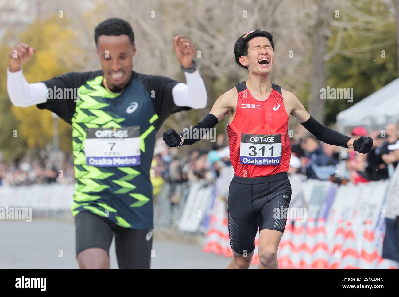 ADANE Yihunilign of Ethiopia (L) and Ryota Kondo of Japan competes near ...