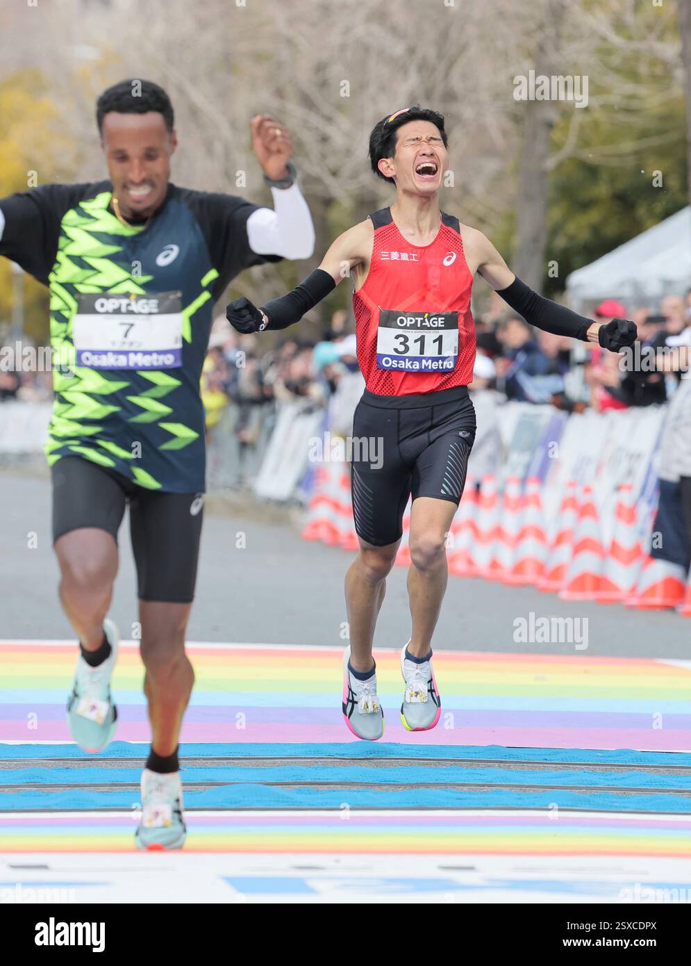 ADANE Yihunilign of Ethiopia (L) and Ryota Kondo of Japan competes near ...