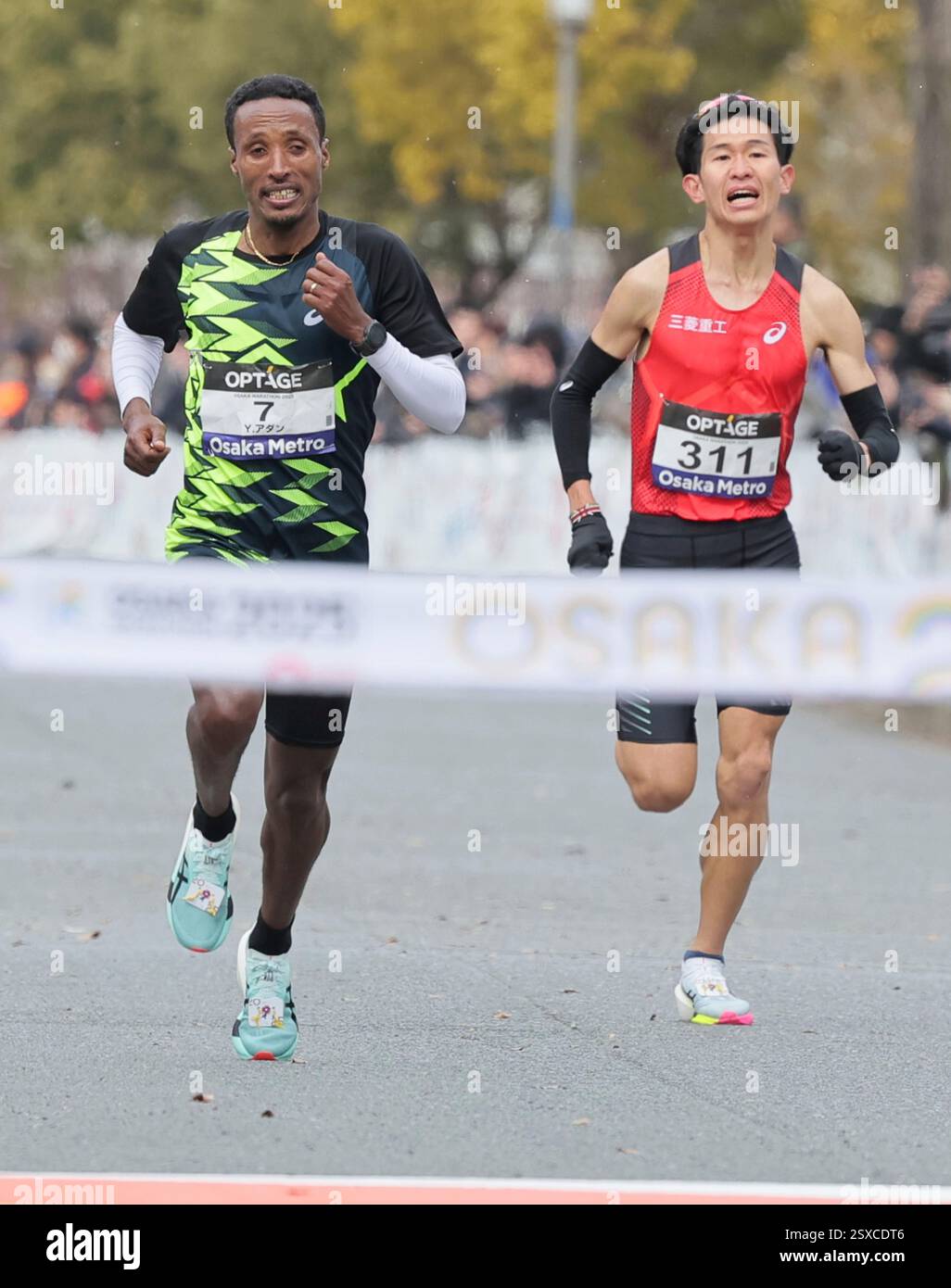 ADANE Yihunilign of Ethiopia (L) and Ryota Kondo of Japan competes near ...
