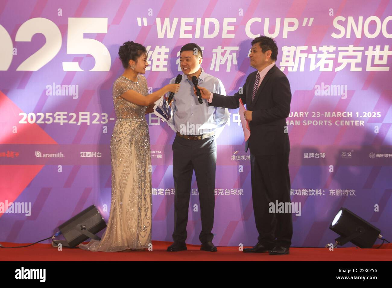 Shangrao,China.22th February 2025. Ding Junhui (C) of China receives an interview during the opening ceremony of Weide Cup World Open 2025 on February 22, 2025 in Shangrao, Jiangxi Province of China. Credit: Liu Lixin/China News Service/Alamy Live News Stock Photo