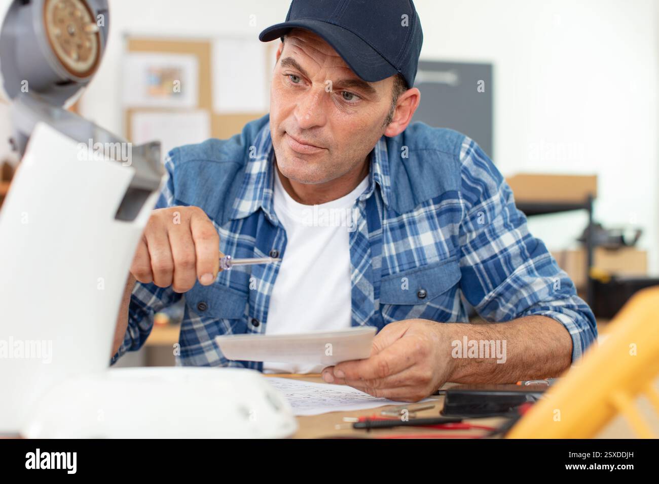 professional worker fixing coffee machine Stock Photo