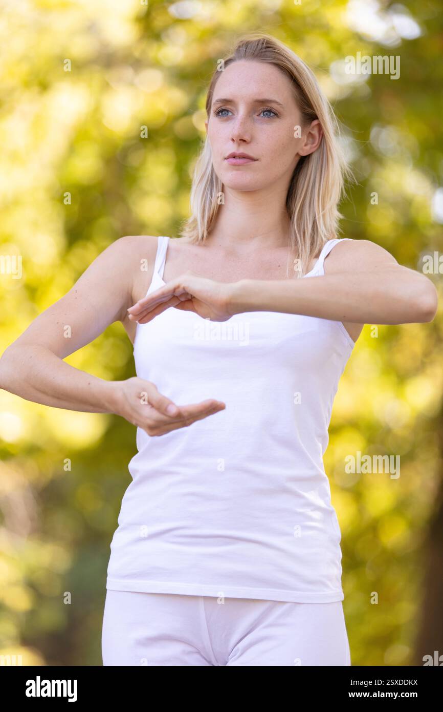 caucasian woman practices thai chi Stock Photo