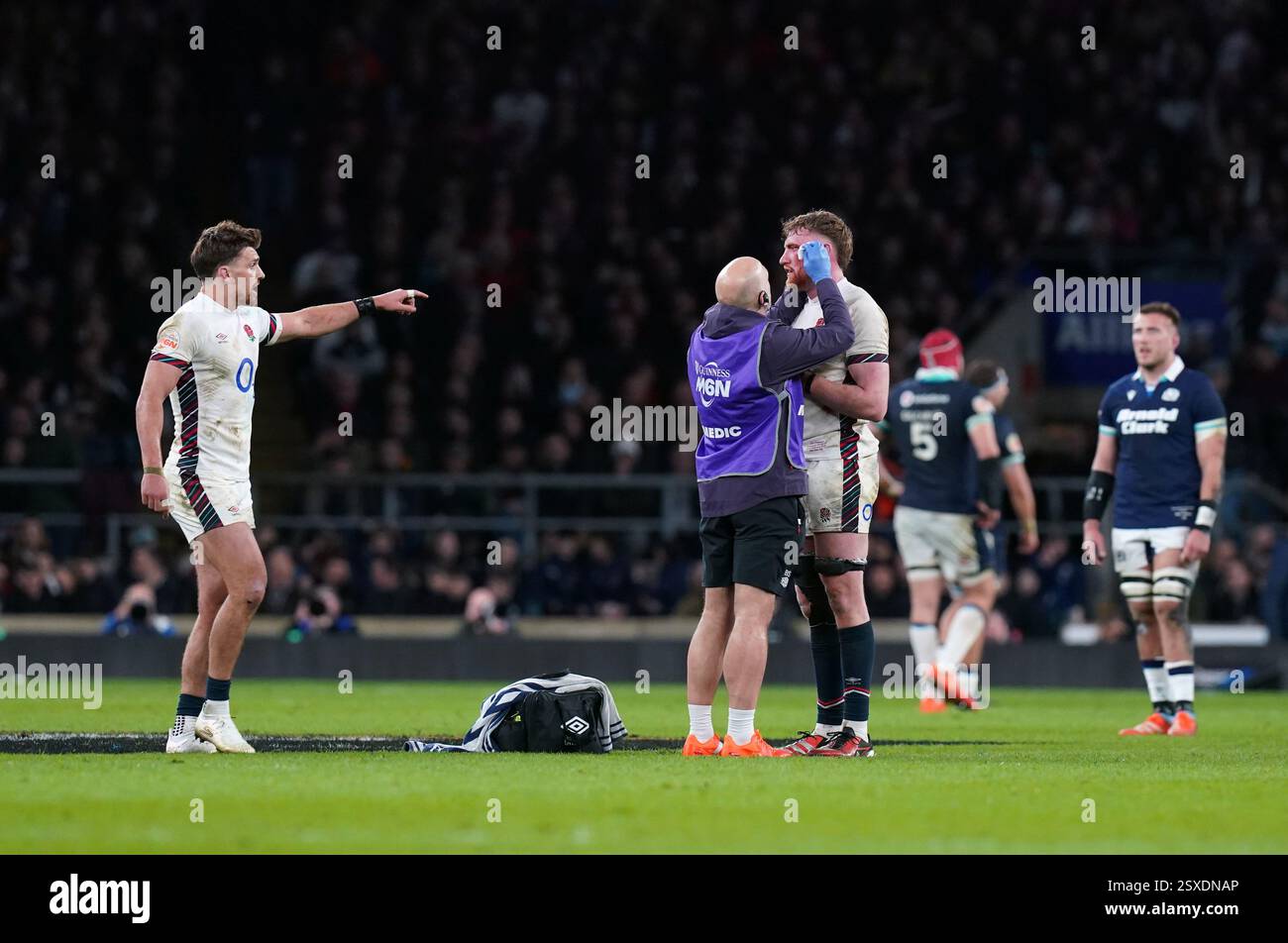 England's Ollie Chessum receives treatment for an injury during the ...