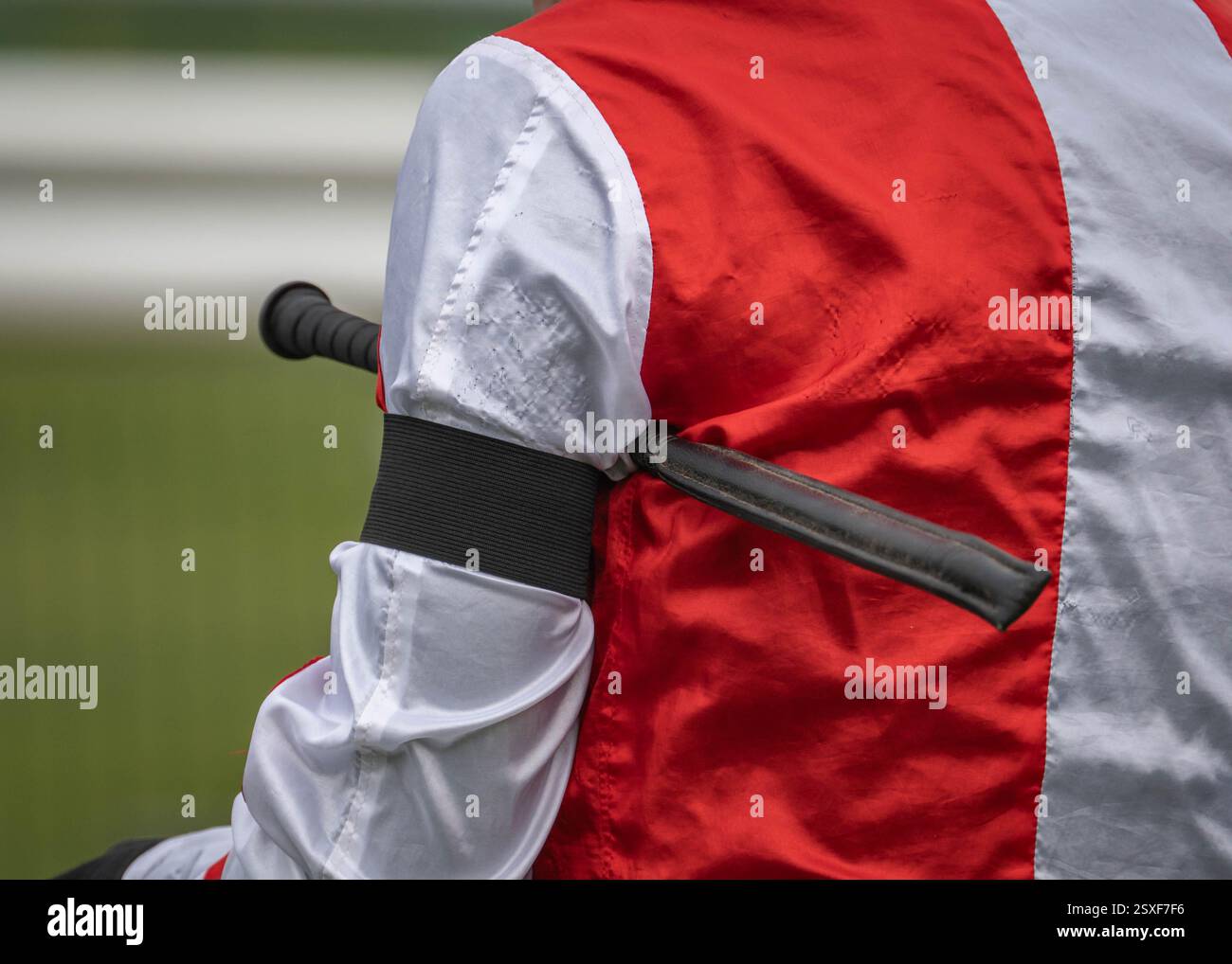 Jockey wearing black armband as mark of respect Stock Photo - Alamy