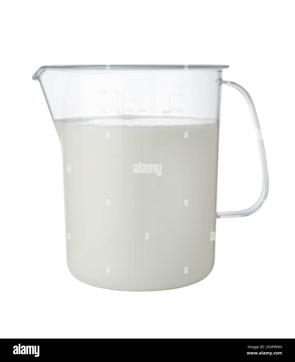 Fresh milk in a large plastic measuring cup isolated on white Stock ...
