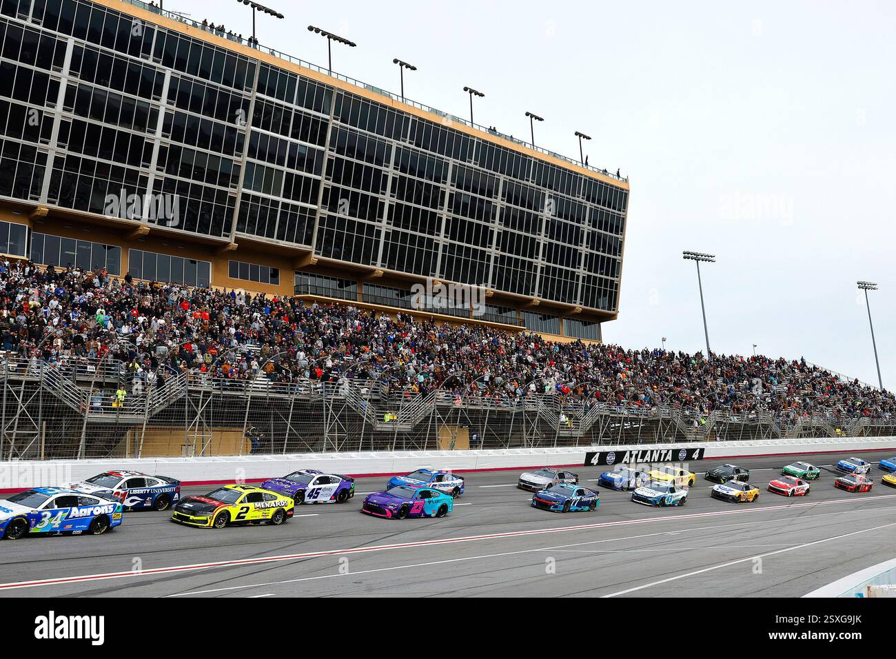 HAMPTON, GA - FEBRUARY 23: The race cars move through Turn 4 during the ...