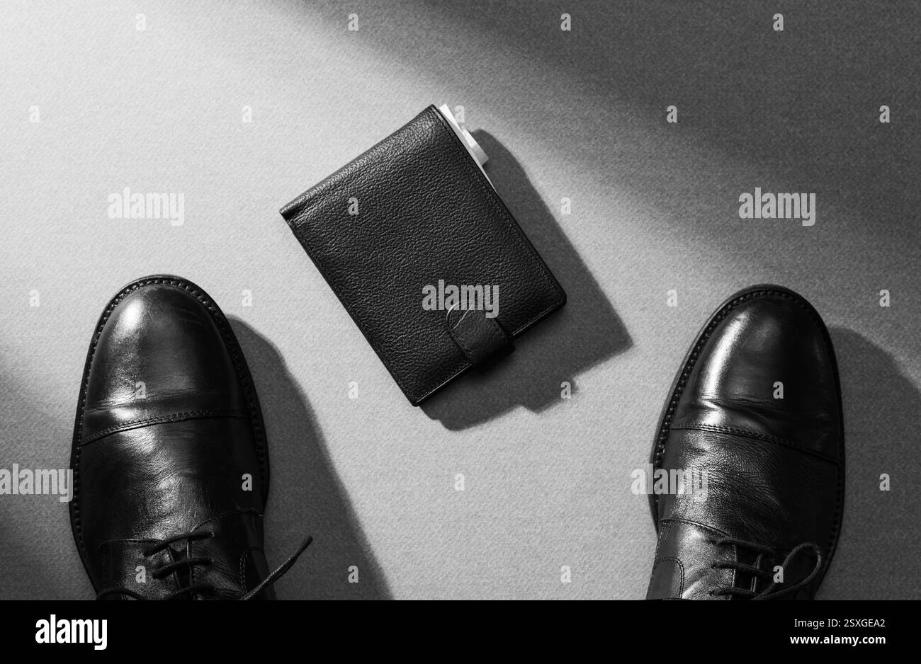 Lucky businessman finding a wallet on the floor, point of view shot Stock Photo
