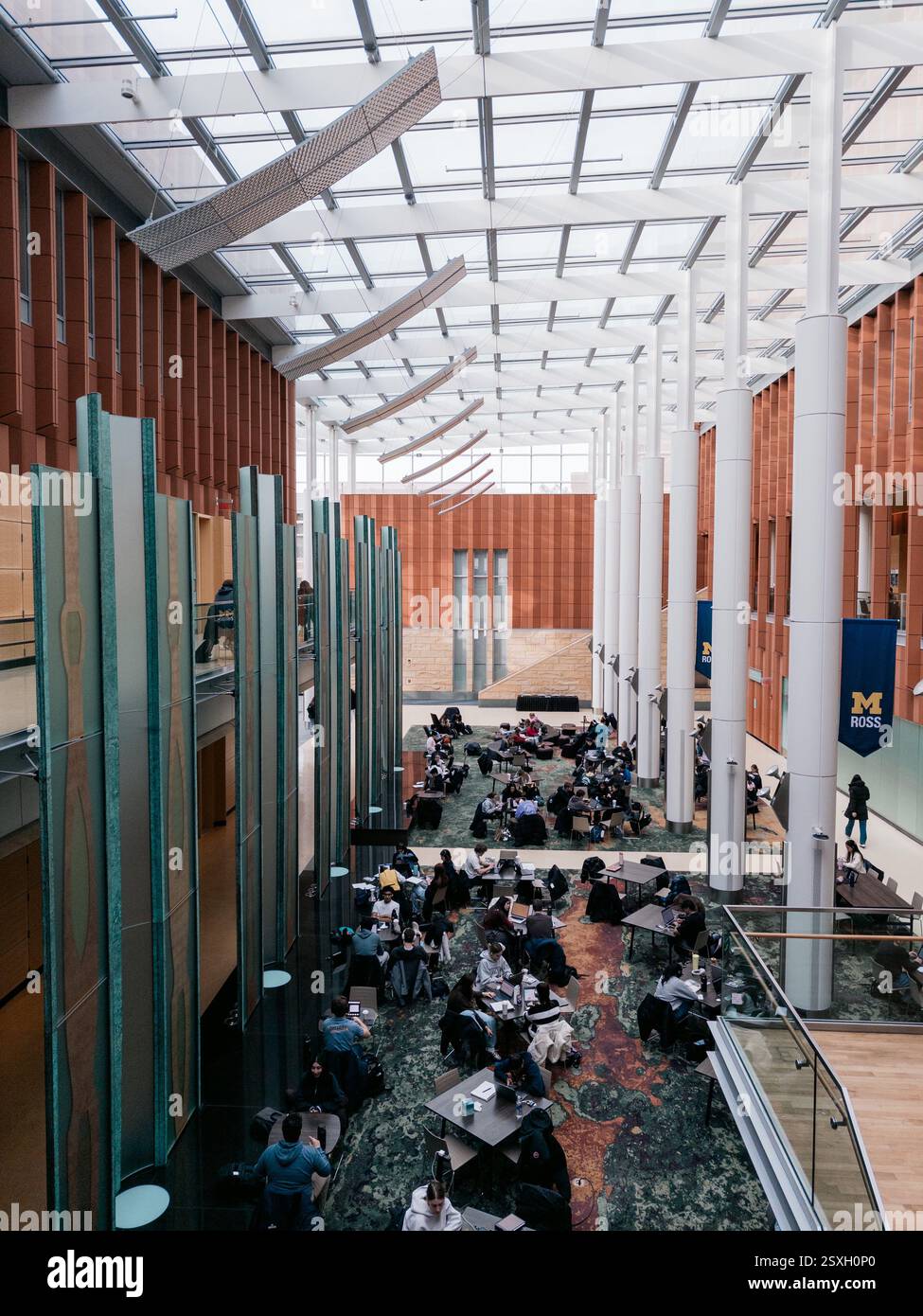 Students studying in the Davidson Winter Garden common area in the Ross School of Business, University of Michigan, Ann Arbor Michigan USA - Smartphone Captured Stock Image